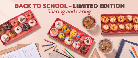 Back to school themed donut gift boxes displayed on a light beige background with school supplies and iced coffee cups. The text at the top reads 'BACK TO SCHOOL - LIMITED EDITION Sharing and caring'.